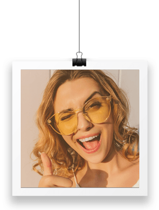 smiling woman in a polaroid-like frame (white border)